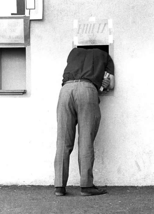 Framed Print : Man looking through a small window of a ticket sale Framed Print : Man looking through a small window of a ticket sale