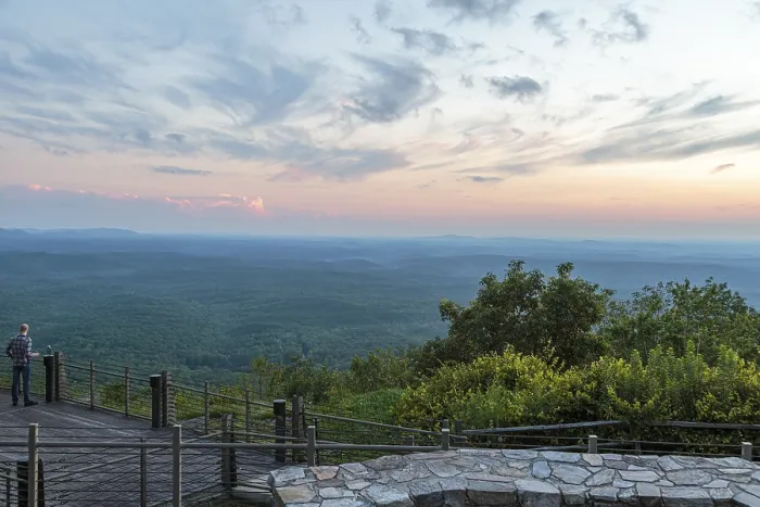 Framed Print : Man looking out over the valley at sunset from the Vista Cliffside Restaurant in Cheaha State Park near Delta