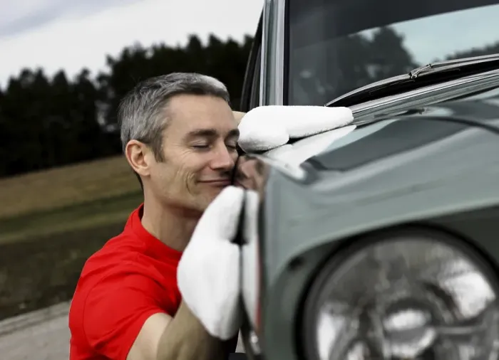 Framed Print : Man lovingly caring for his vintage car