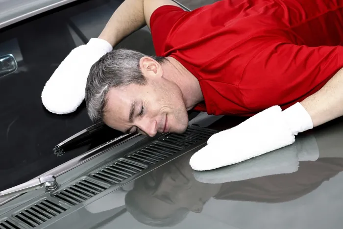 Framed Print : Man lovingly caring for his vintage car Framed Print : Man lovingly caring for his vintage car