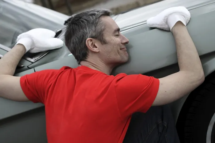 Framed Print : Man lovingly caring for his vintage car Framed Print : Man lovingly caring for his vintage car