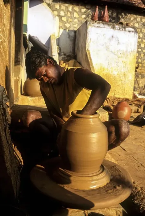 Framed Print : A man making Ghatam percussion instrument at Manamadurai Framed Print : A man making Ghatam percussion instrument at Manamadurai