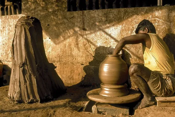 Framed Print : A man making Ghatam percussion instrument at Manamadurai