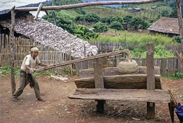 Framed Print : Man with an old grain pestle in a rural village, Northern Thailand, Asia 1971 Framed Print : Man with an old grain pestle in a rural village, Northern Thailand, Asia 1971