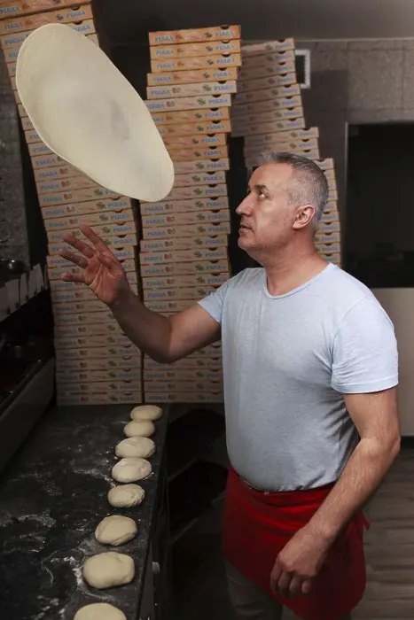 Framed Print : Man, pizza baker, juggles with pizza dough Framed Print : Man, pizza baker, juggles with pizza dough