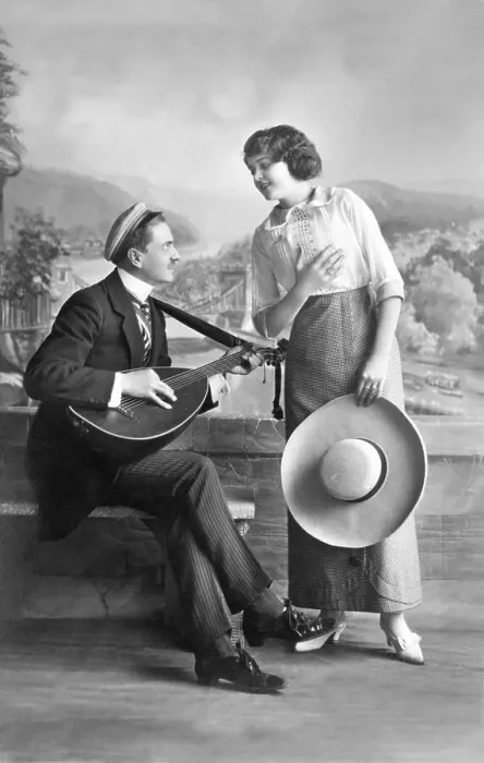 Framed Print : Man playing music for a woman, historical image