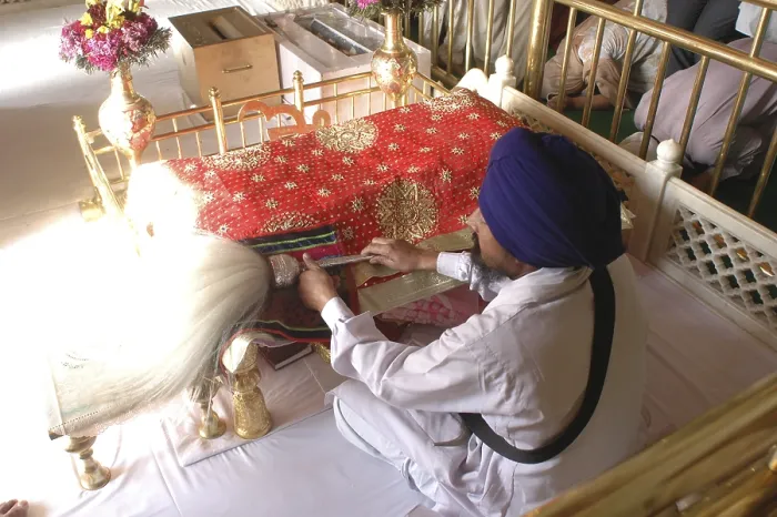 Framed Print : Man reading Adigranth, Akaltakhat Golden temple Framed Print : Man reading Adigranth, Akaltakhat Golden temple
