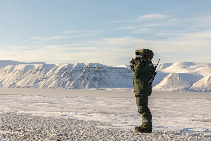 Framed Print : Man with a rifle and binoculars looks out on the horizon in arctic landscape in Billefjorden Framed Print : Man with a rifle and binoculars looks out on the horizon in arctic landscape in Billefjorden