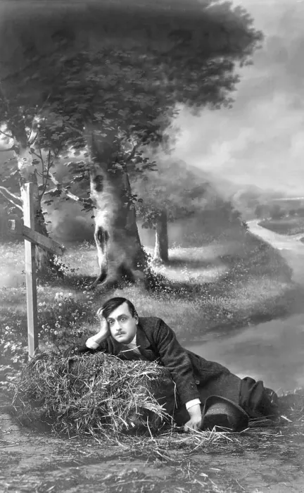 Framed Print : Man seated beside a grave, historical image
