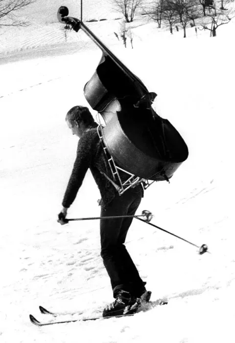 Framed Print : Man is skiing with bass ca. 1970s Framed Print : Man is skiing with bass ca. 1970s