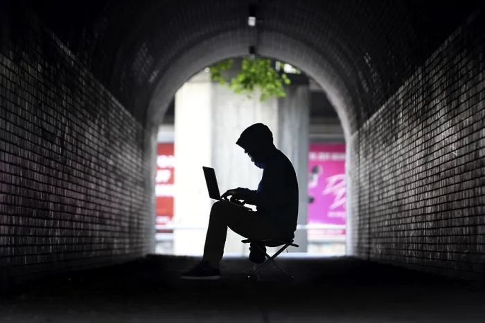 Framed Print : Man surfing on a laptop computer in a pedestrian tunnel Framed Print : Man surfing on a laptop computer in a pedestrian tunnel