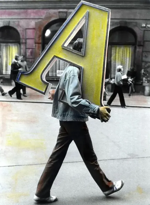 Framed Print : Man transporting letter A ca. 1970s Framed Print : Man transporting letter A ca. 1970s