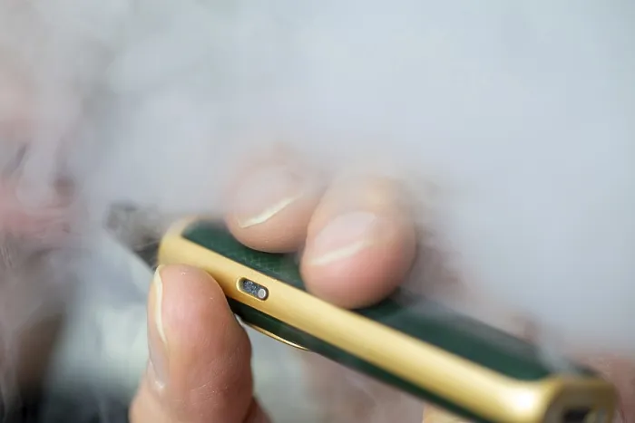 Framed Print : Man vaping an e-cigarette
