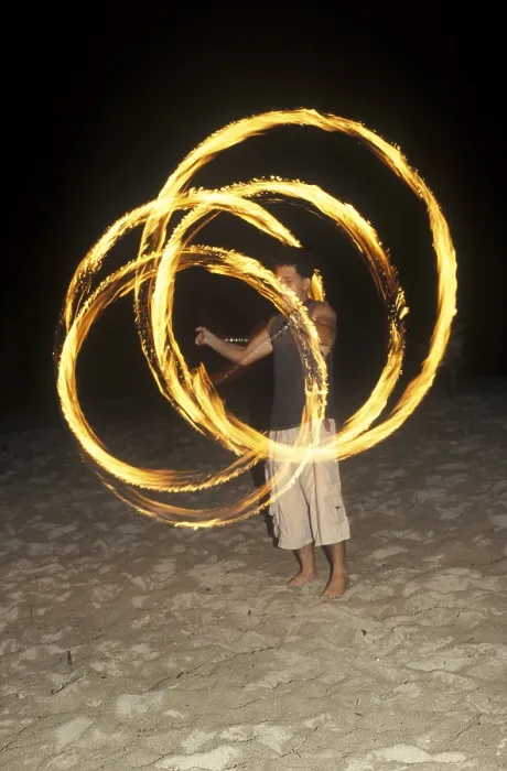 Framed Print : A man waves burning torches on the beach of Coral Beach Resort on the island of Ko Lanta