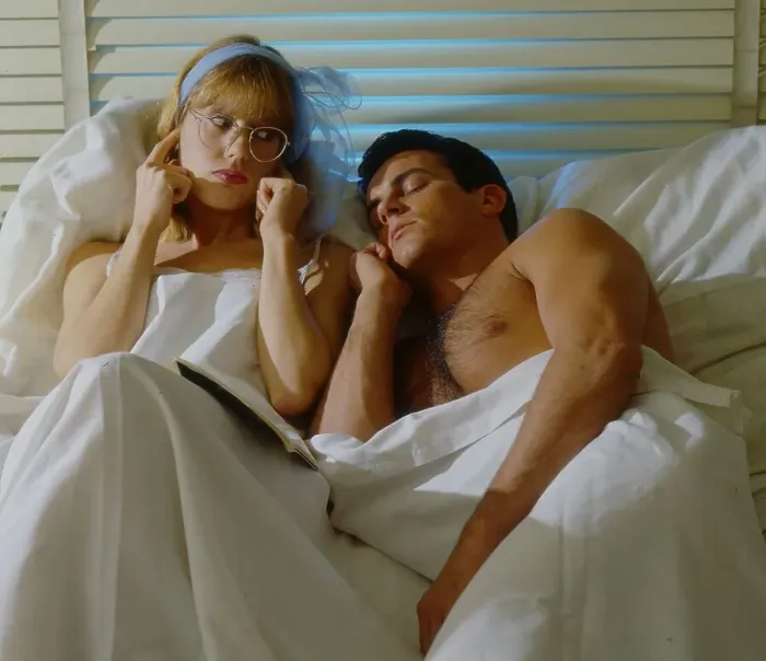 Framed Print : Man and woman in bed Woman covers her ears