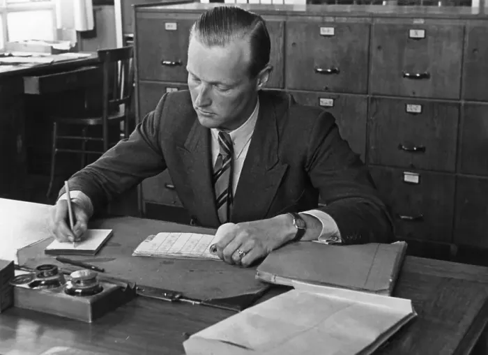 Framed Print : Man writing in his office, historic picture from about 1940 Framed Print : Man writing in his office, historic picture from about 1940