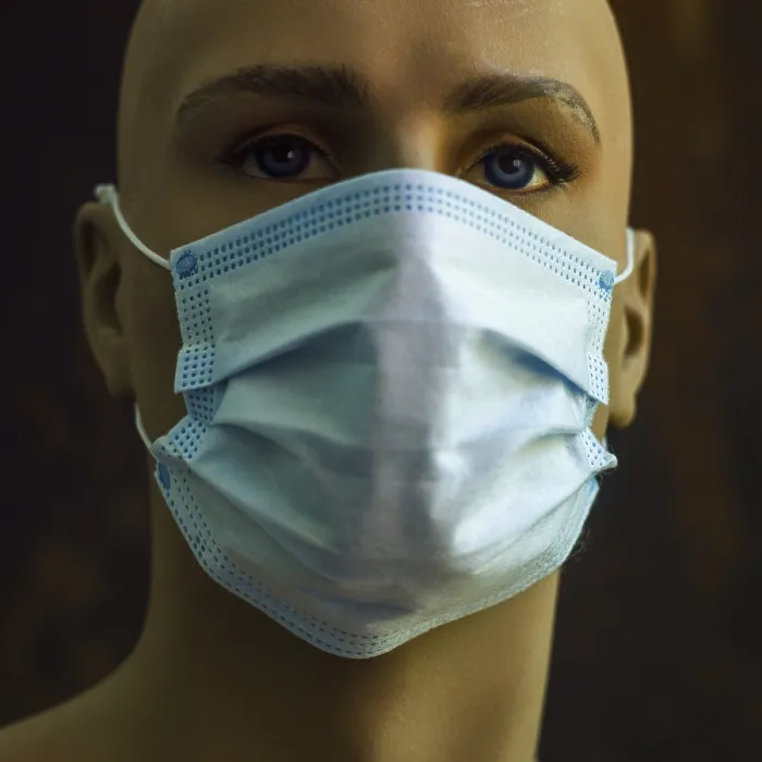Framed Print : A mannequin displays a light blue surgical mask