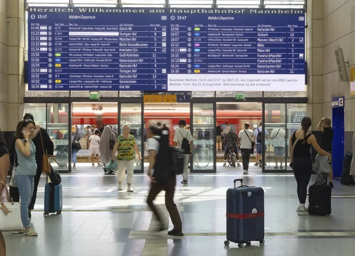 Framed Print : Mannheim main station, interior view with people and display board
