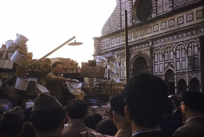 Framed Print : Market trader selling to a crowd on the street, next to the cathedral, Florence, Italy, 1957, Europe