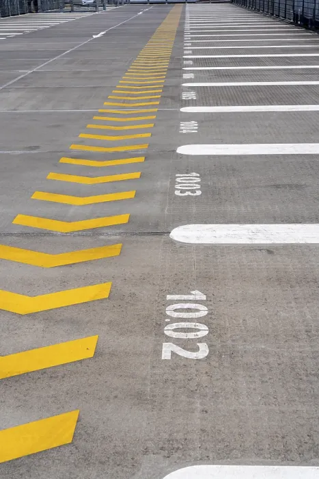 Framed Print : Markings on a car park deck, Direction of travel marking