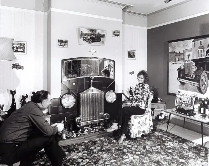 Framed Print : Married couple sitting in apartment with car decoration