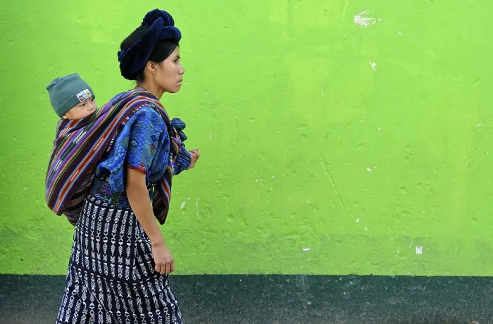 Framed Print : Mayan woman carrying a child, Antigua