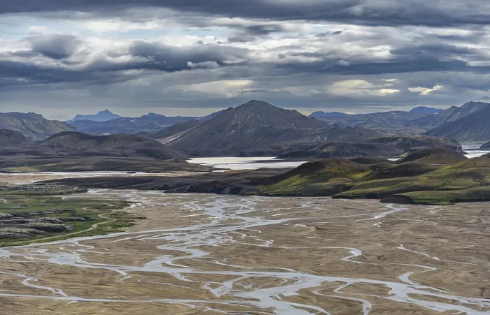 Framed Print : Meandering river in volcanic landscape with mountains