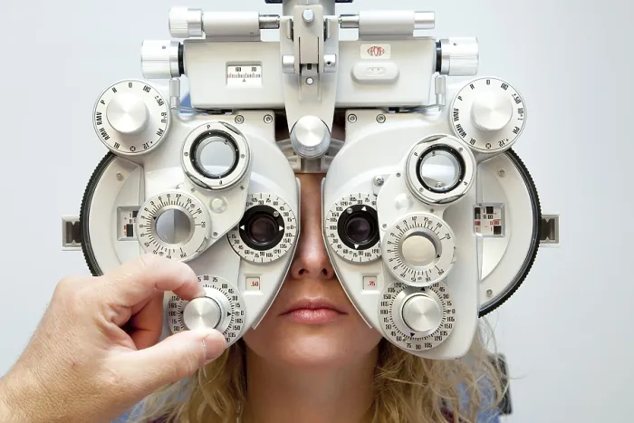 Framed Print : Measurement of the eyesight by using a phoropter to determine the prescription for glasses Framed Print : Measurement of the eyesight by using a phoropter to determine the prescription for glasses