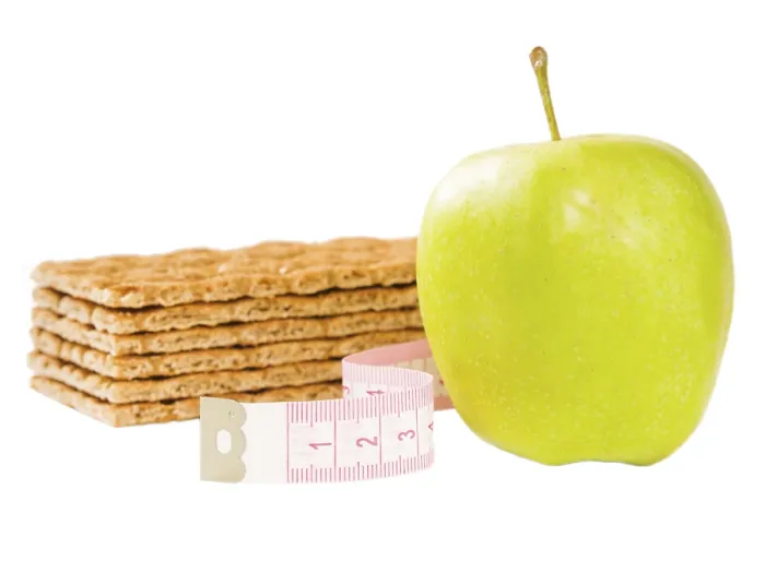 Framed Print : Measuring tape, crispbread and delicious green apple isolated on white