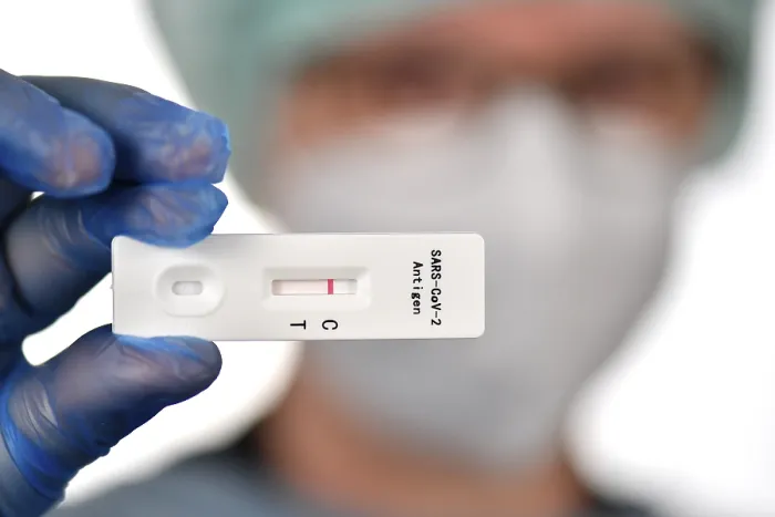 Framed Print : Medical staff shows negative antigen rapid test