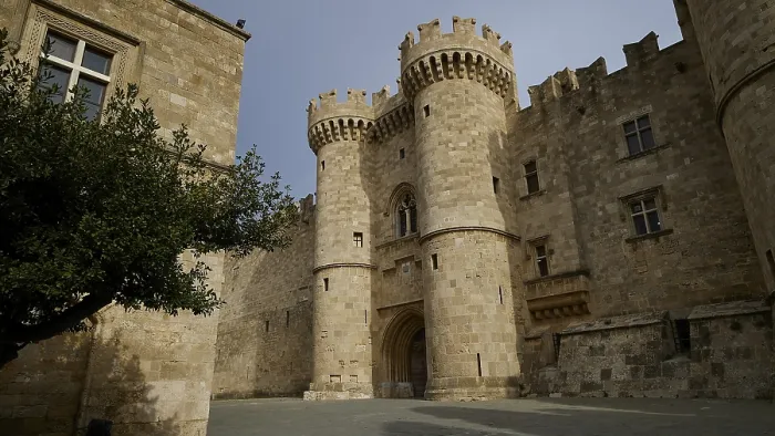 Framed Print : Medieval castle with striking towers under a clear sky