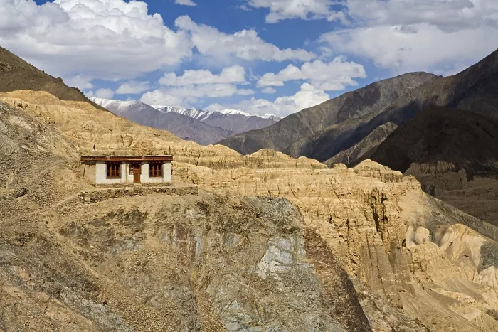 Framed Print : One of meditation cell of Lamayuru Buddhist Monastery rising above mass of eroded cliffs on Leh Kargil road
