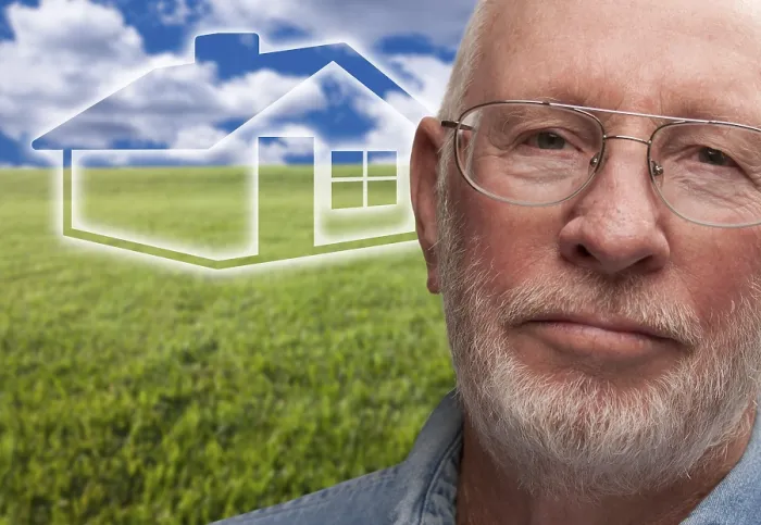 Framed Print : Melancholy senior man with green grass field and ghosted house behind him Framed Print : Melancholy senior man with green grass field and ghosted house behind him