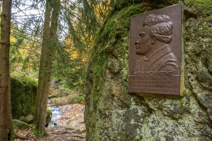 Framed Print : A memorial plaque of Heinrich Heine on a rock in an autumn forest