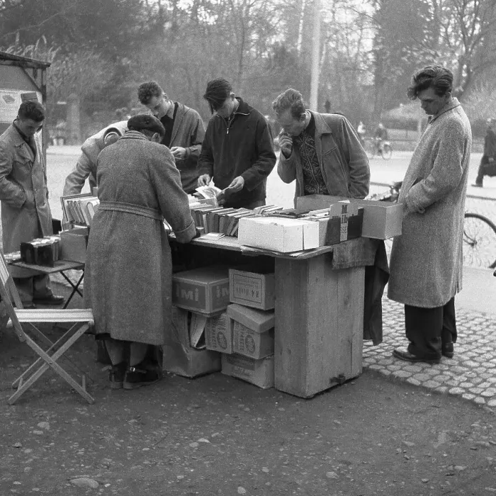 Framed Print : Men browse the books at a market stall