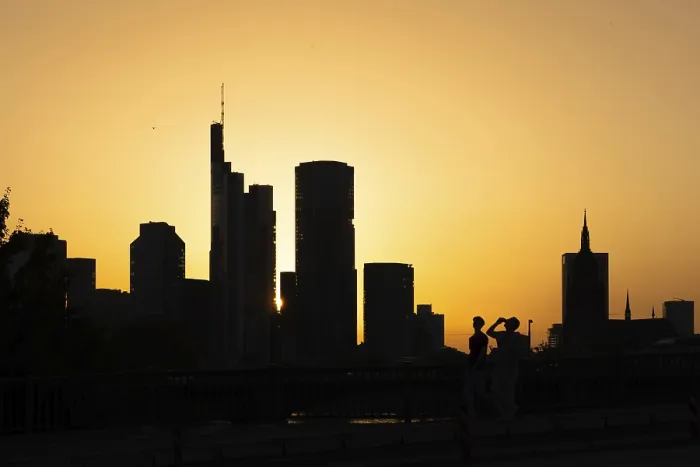 Framed Print : Two men cross the rafter bridge over the Main in the evening as the sun sets behind the Frankfurt banking skyline Framed Print : Two men cross the rafter bridge over the Main in the evening as the sun sets behind the Frankfurt banking skyline