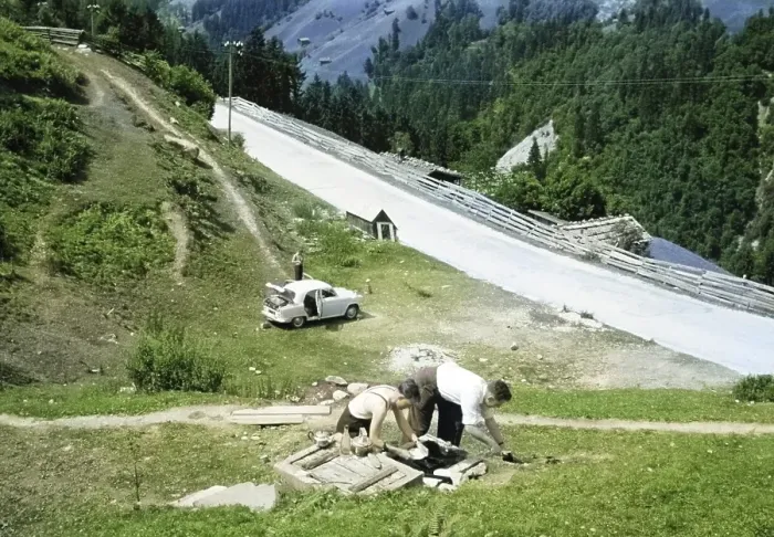 Framed Print : Men making tea and food, British Austin Cambridge A40 car in Austria, overland drive adventure across Europe, 1956 colourised Ektachrome slide