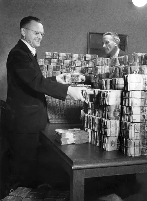 Framed Print : Men piling up money during the currency reform Framed Print : Men piling up money during the currency reform