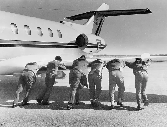 Framed Print : Men pushing an airplane, Mexico City