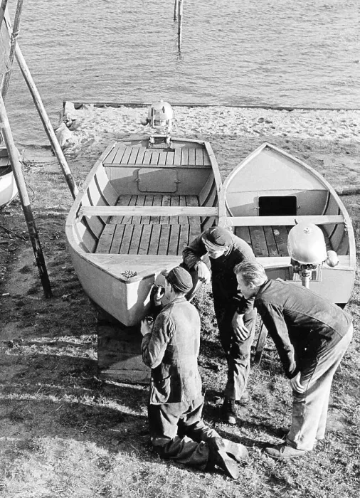 Framed Print : Three men repairing a boat, 1960s