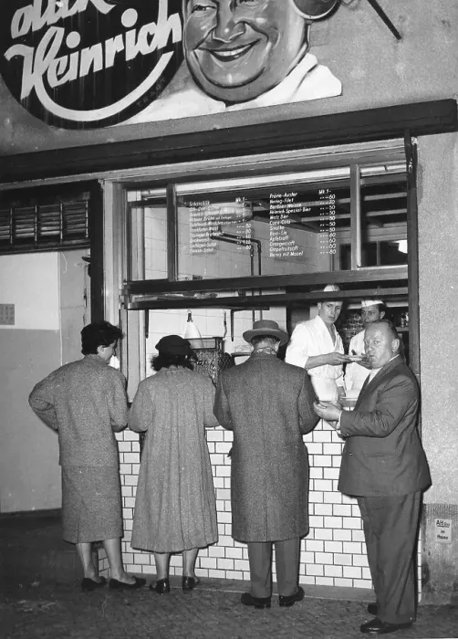 Framed Print : Men and women eat sausages, 1960s