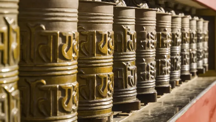 Framed Print : Metal prayer wheels in a row, artfully decorated Framed Print : Metal prayer wheels in a row, artfully decorated