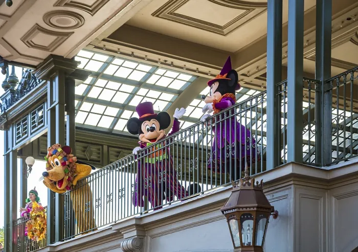 Framed Print : Mickey Mouse, Minnie Mouse, and Pluto welcome guests to the Magic Kingdom at Walt Disney World
