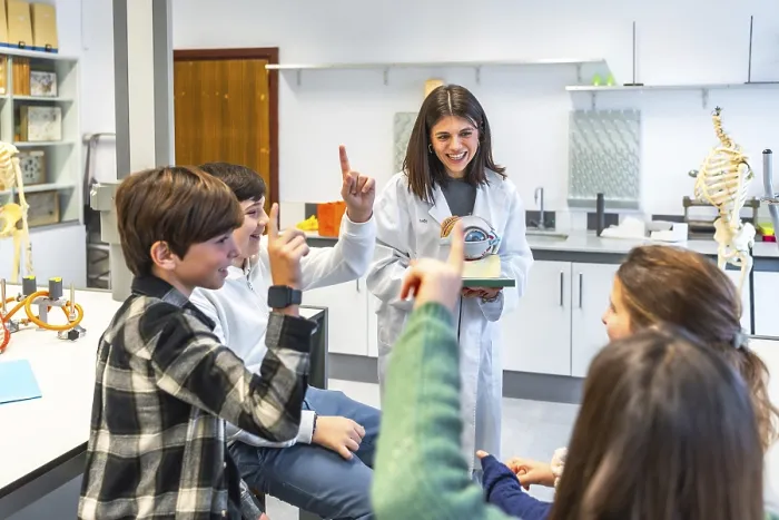 Framed Print : Middle school students participating in anatomy class Framed Print : Middle school students participating in anatomy class