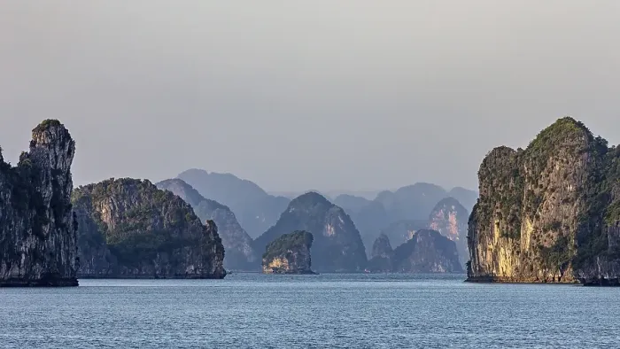 Framed Print : Mighty rocky islands in the soft light of dusk over a calm sea