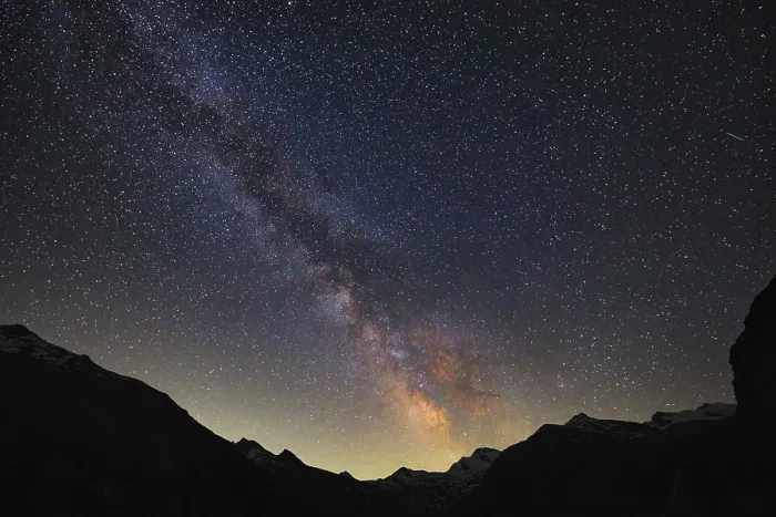 Framed Print : The Milky Way illuminates the night sky over the mountains