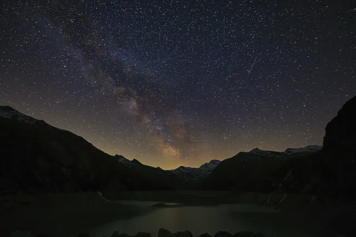 Framed Print : The Milky Way shines over the dark mountain peaks Framed Print : The Milky Way shines over the dark mountain peaks