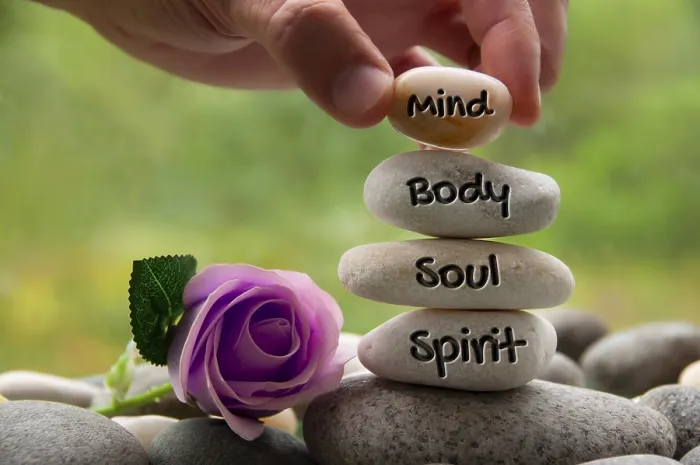 Framed Print : Mind, Body, Soul and Spirit words engraved on zen stones with rose flower