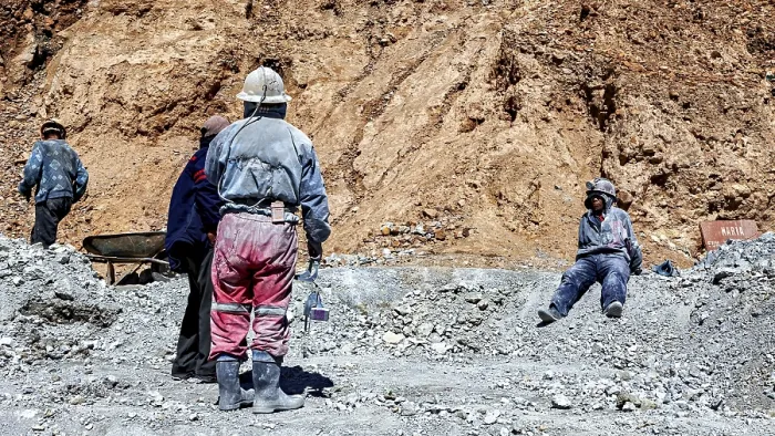Framed Print : Miners in different clothes stand or sit in a barren Framed Print : Miners in different clothes stand or sit in a barren
