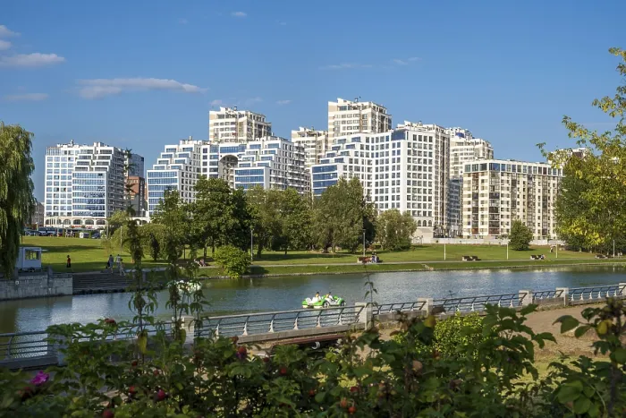 Framed Print : Minsk, Belarus - 08.16.24. Modern residential complex overlooking the river